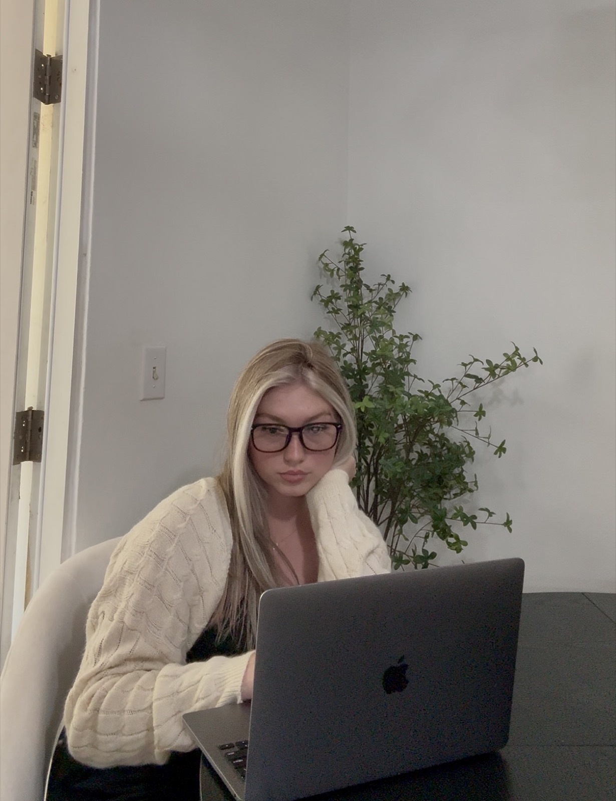 kaelee working on her laptop in glasses